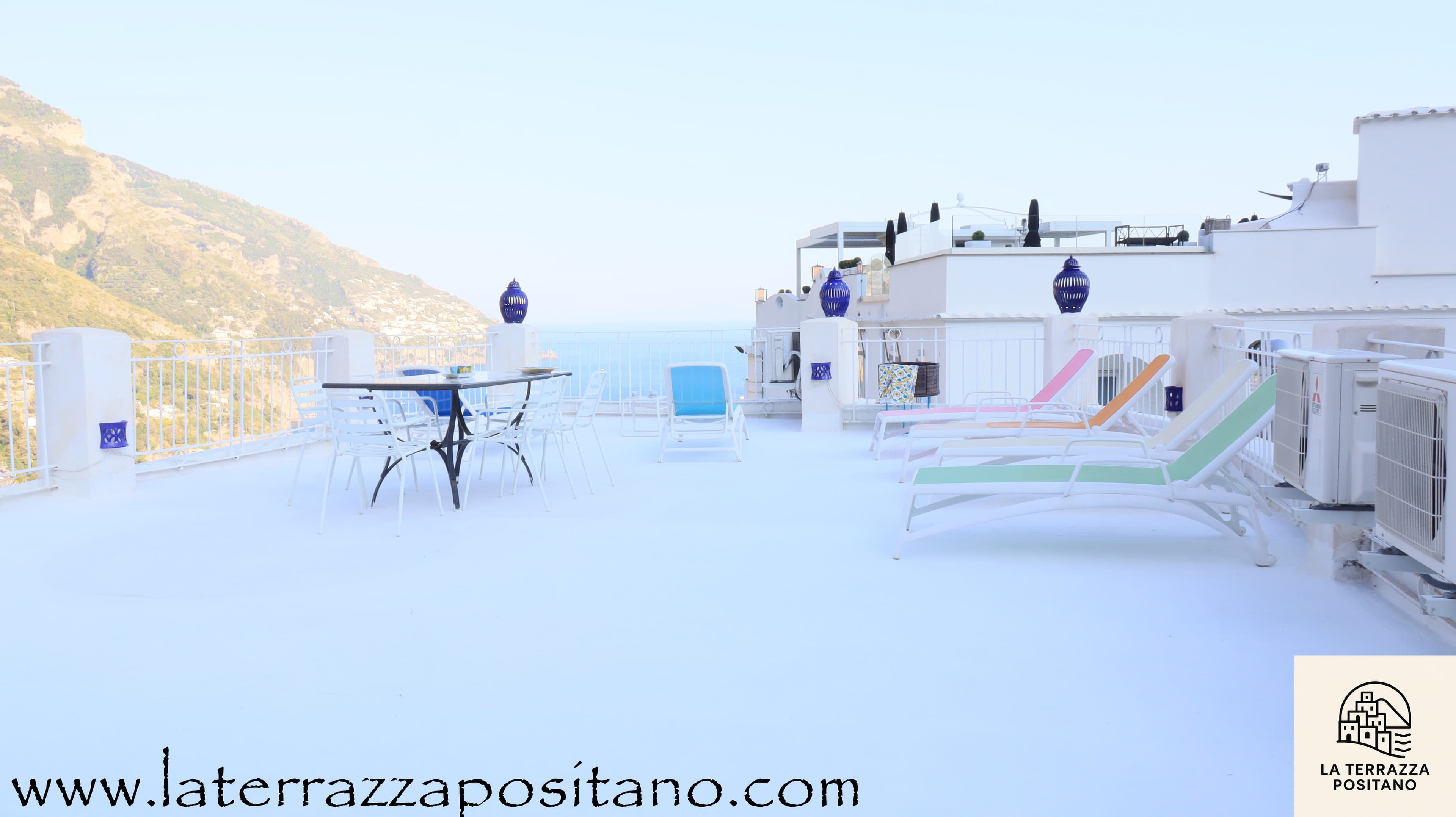 Panoramic rooftop terrace with sun loungers